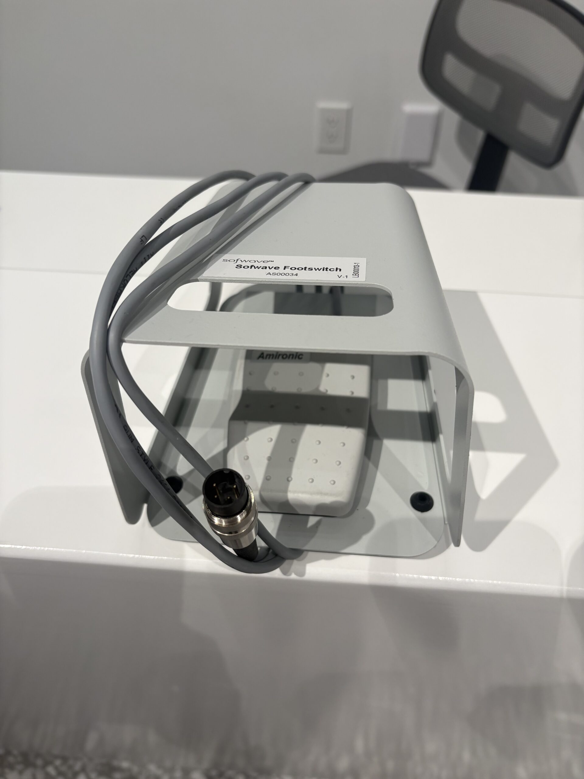 Sofwave footswitch for 2023 skin tightening system shown from angle highlighting durable clinic-use construction