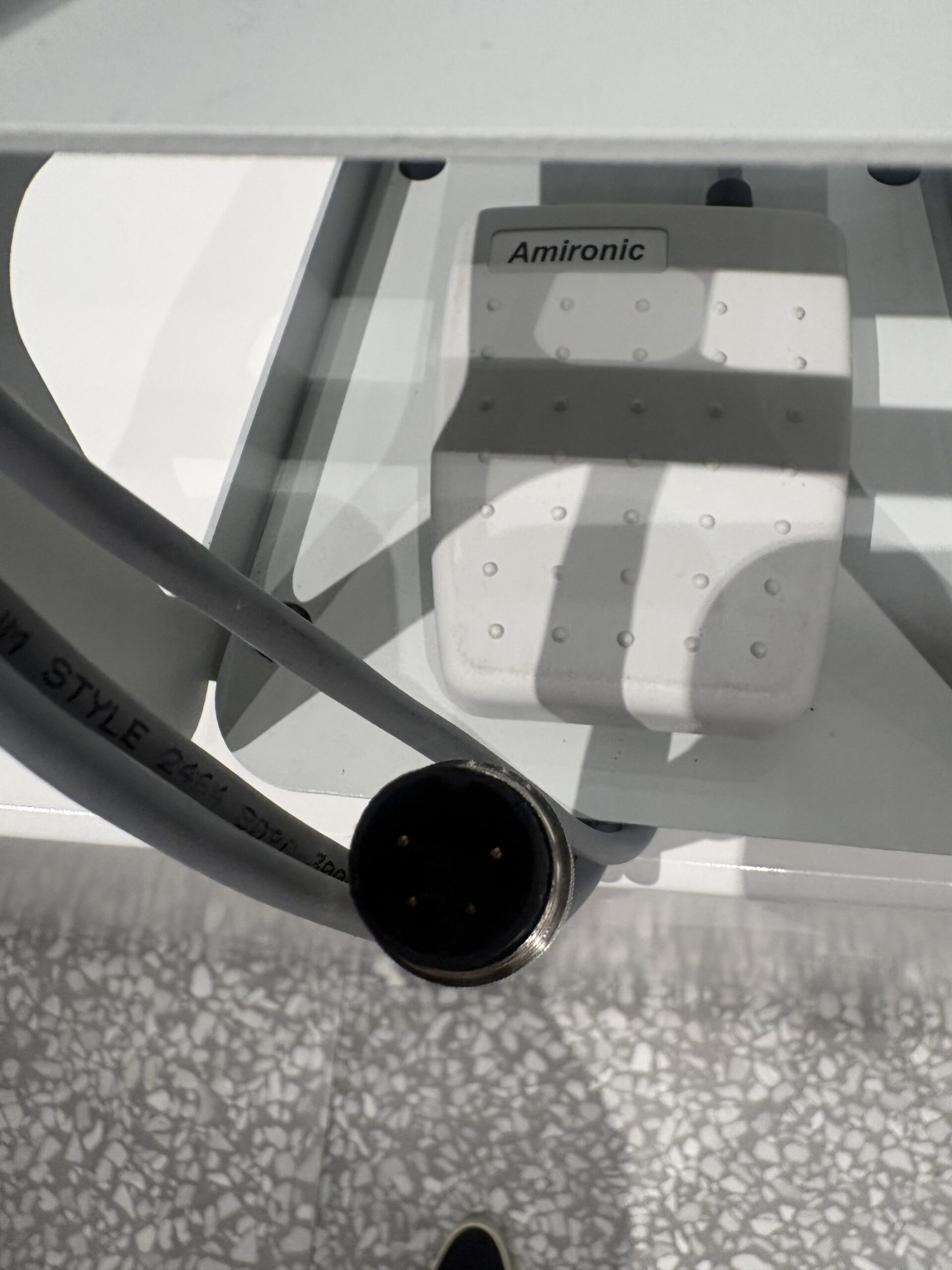 Close-up of Sofwave footswitch pedal showing medical-grade design for use with skin tightening systems