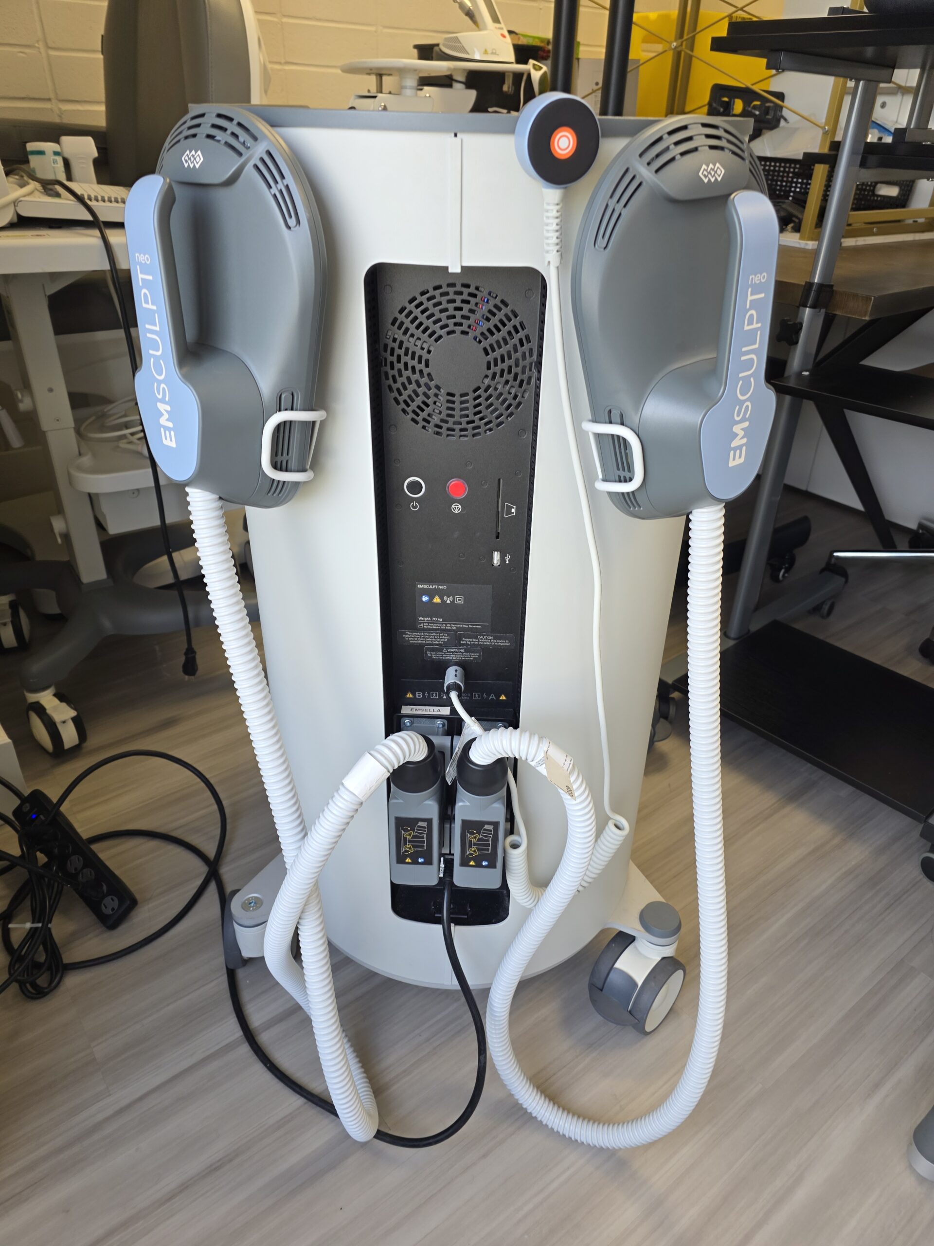 Emsculpt Neo rear side view showing large paddles